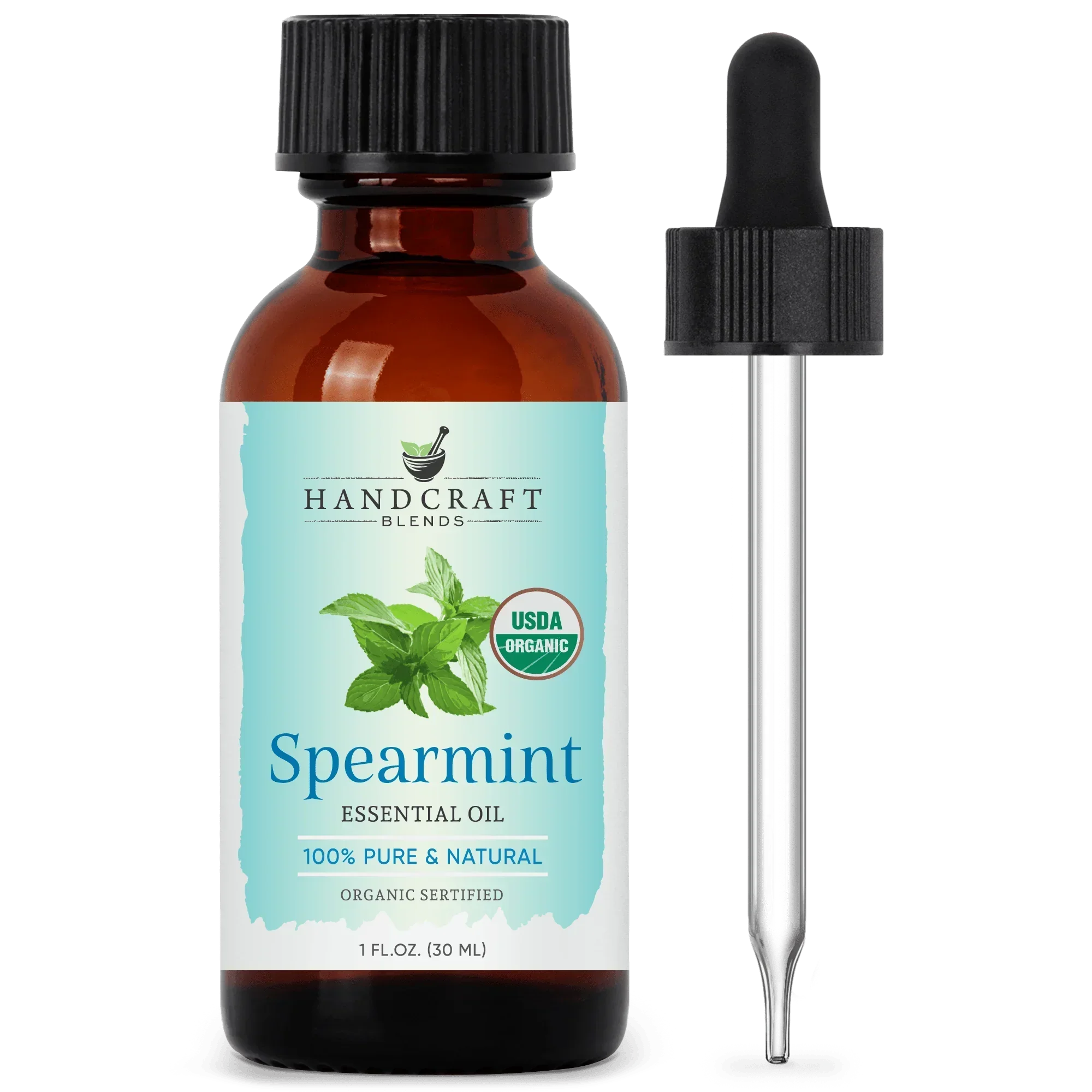 Amber glass bottle of organic spearmint essential oil with dropper, herbal aromatherapy product
