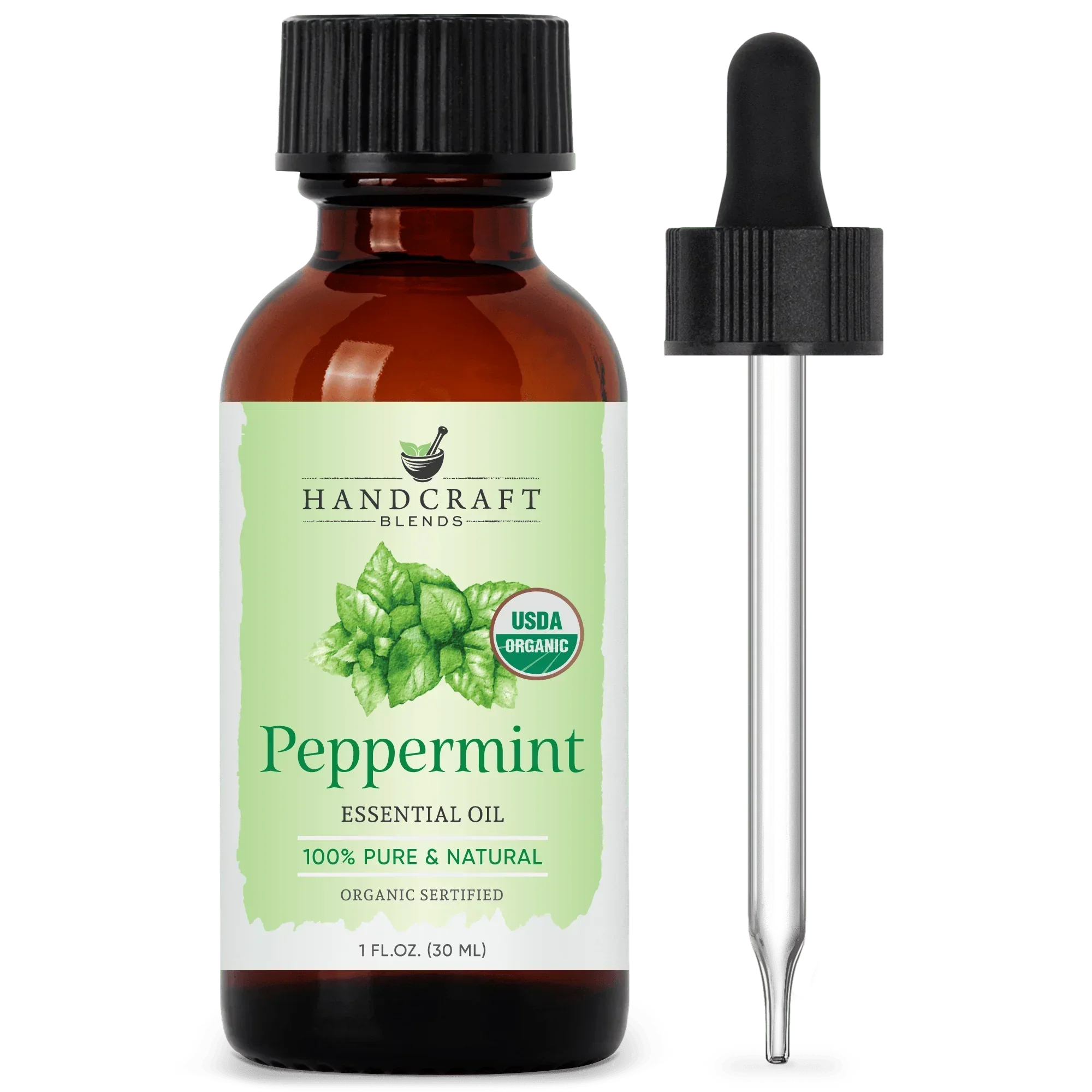 Amber bottle of organic peppermint essential oil with dropper and green mint leaf label
