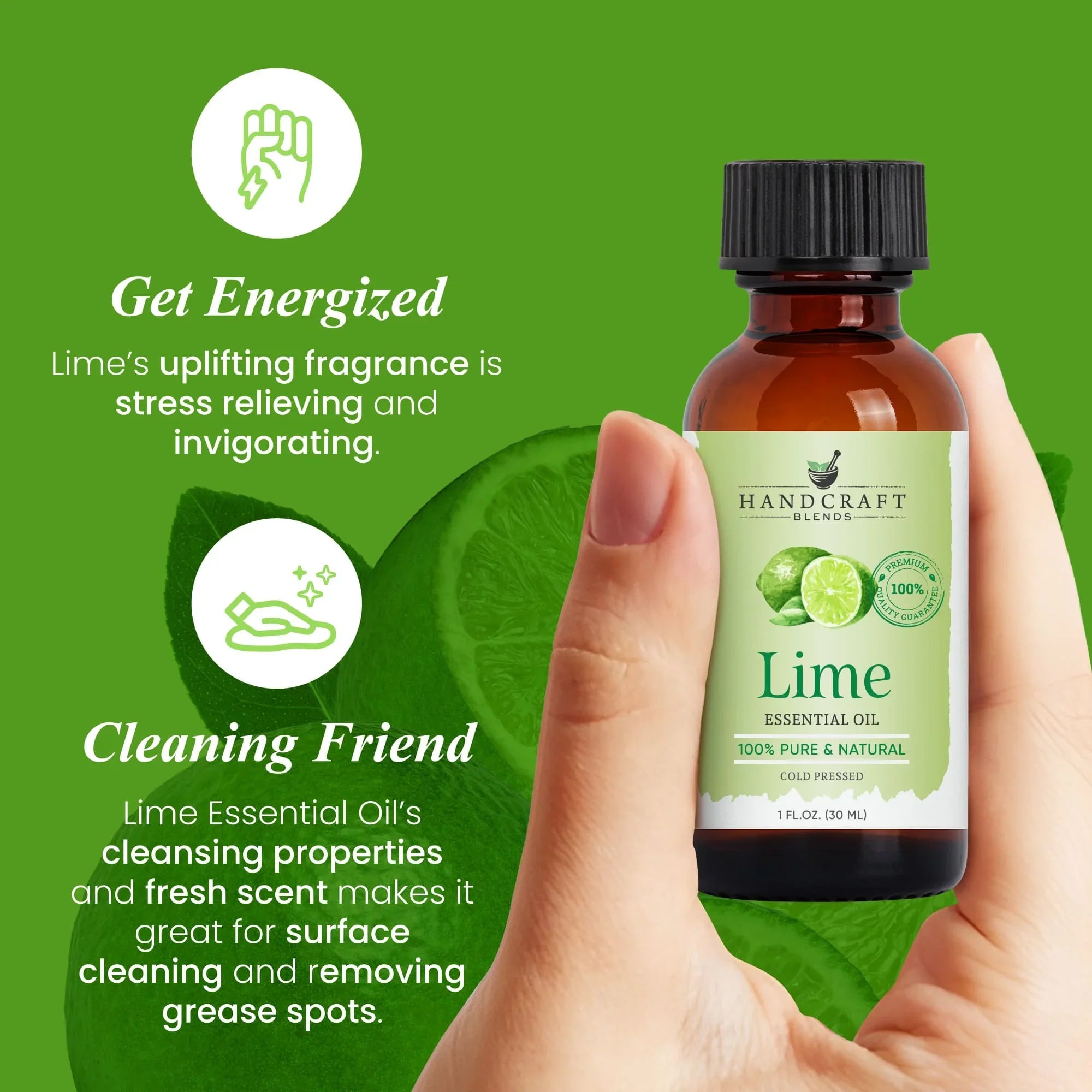 Hand holding a bottle of lime essential oil with sliced lime and green background.