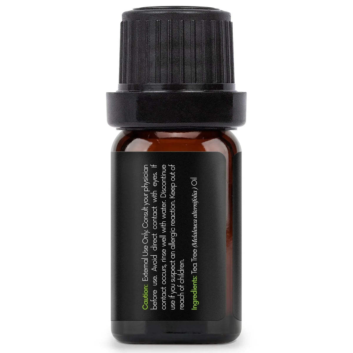 Amber glass bottle with black label for tea tree essential oil, safety and ingredient text visible.