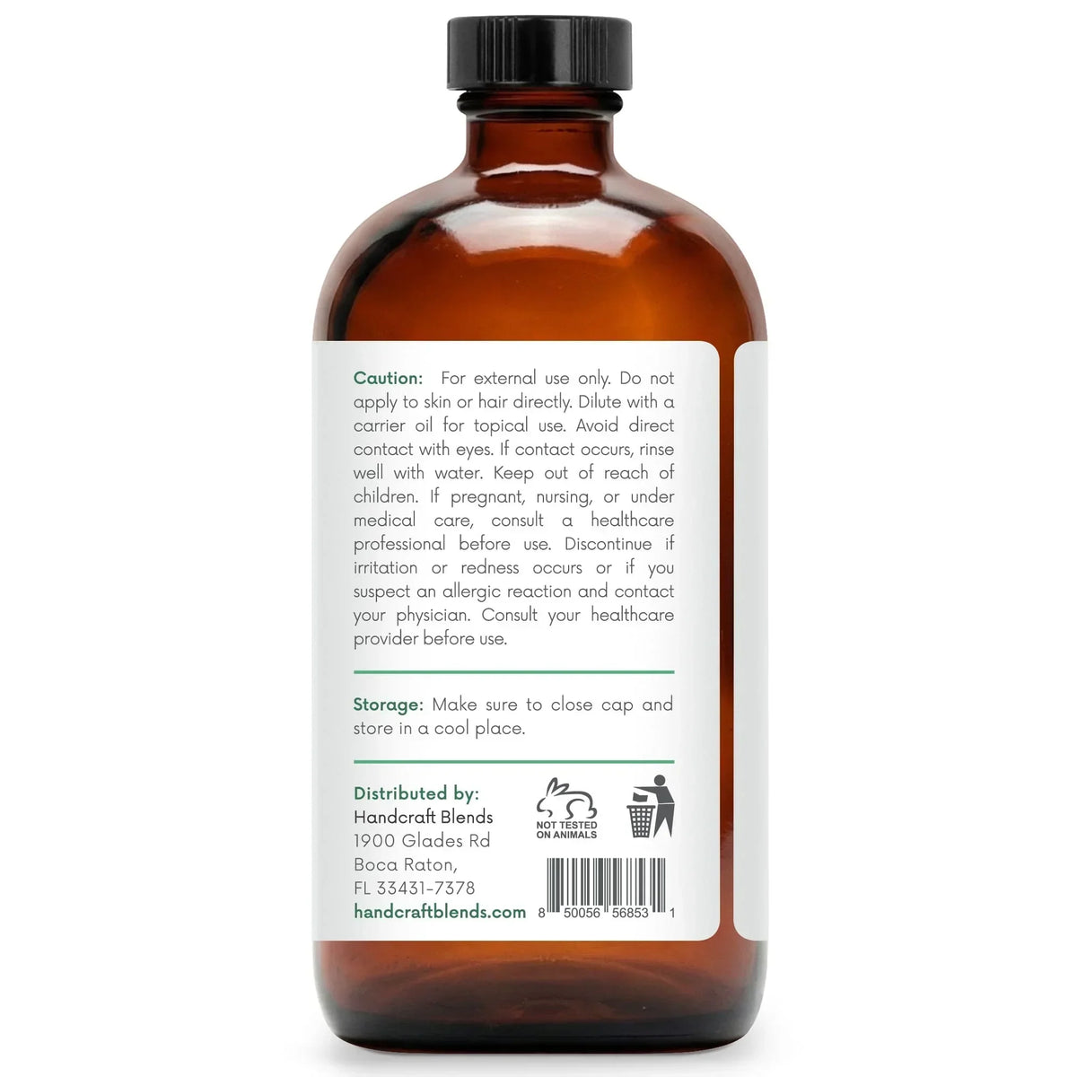 Amber glass essential oil bottle with black cap, showing caution label and product details