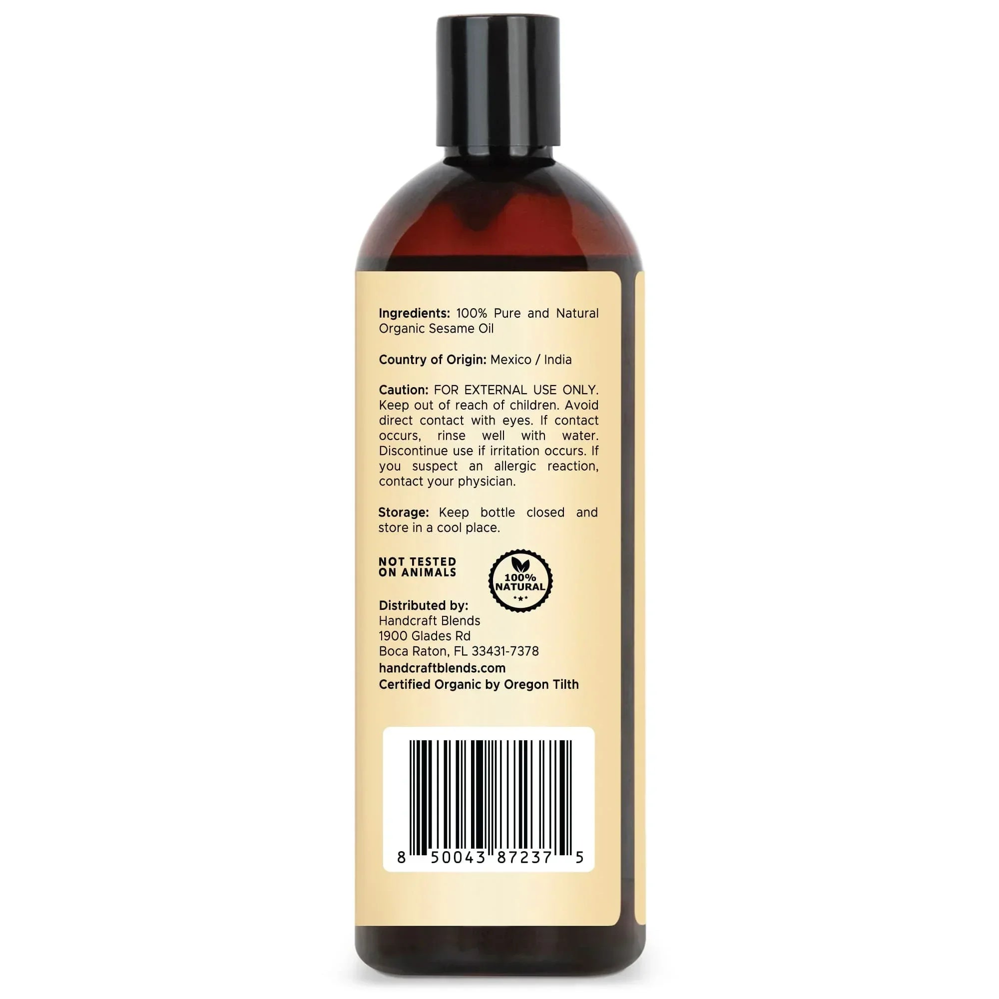 Brown bottle of organic sesame oil with detailed ingredient and caution label, cruelty-free, 16oz