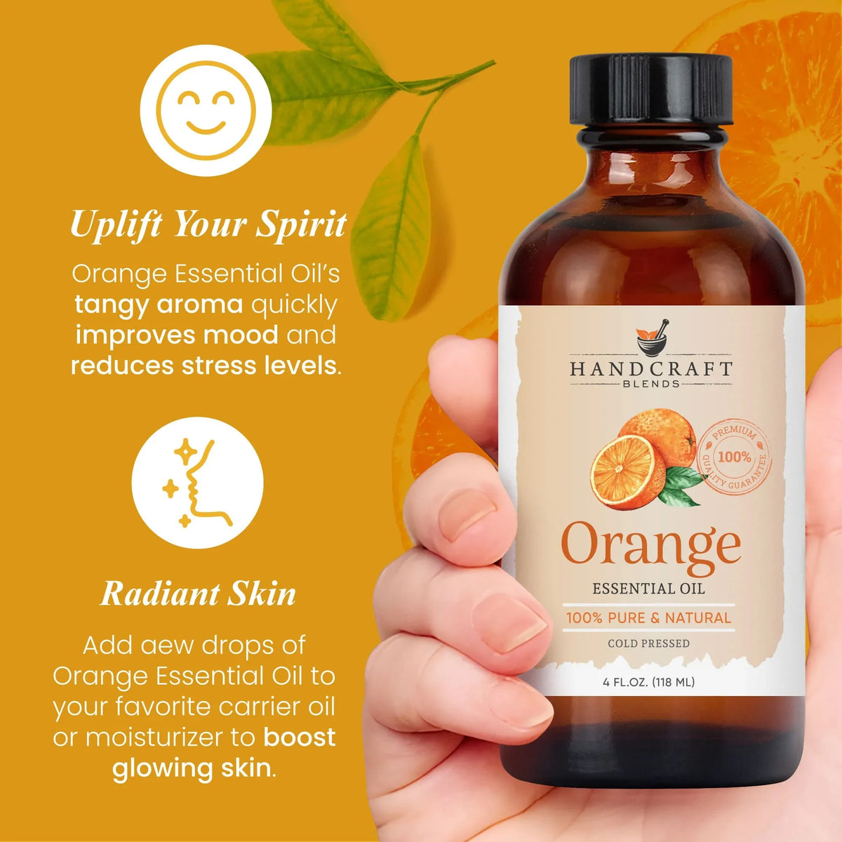 Hand holding 4oz bottle of orange essential oil, label with oranges and wellness benefits text.