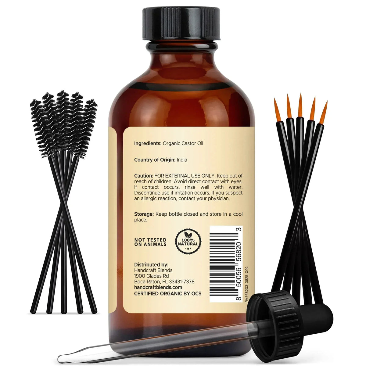 Amber glass bottle of organic castor oil with dropper, spoolie brushes, and fine applicators