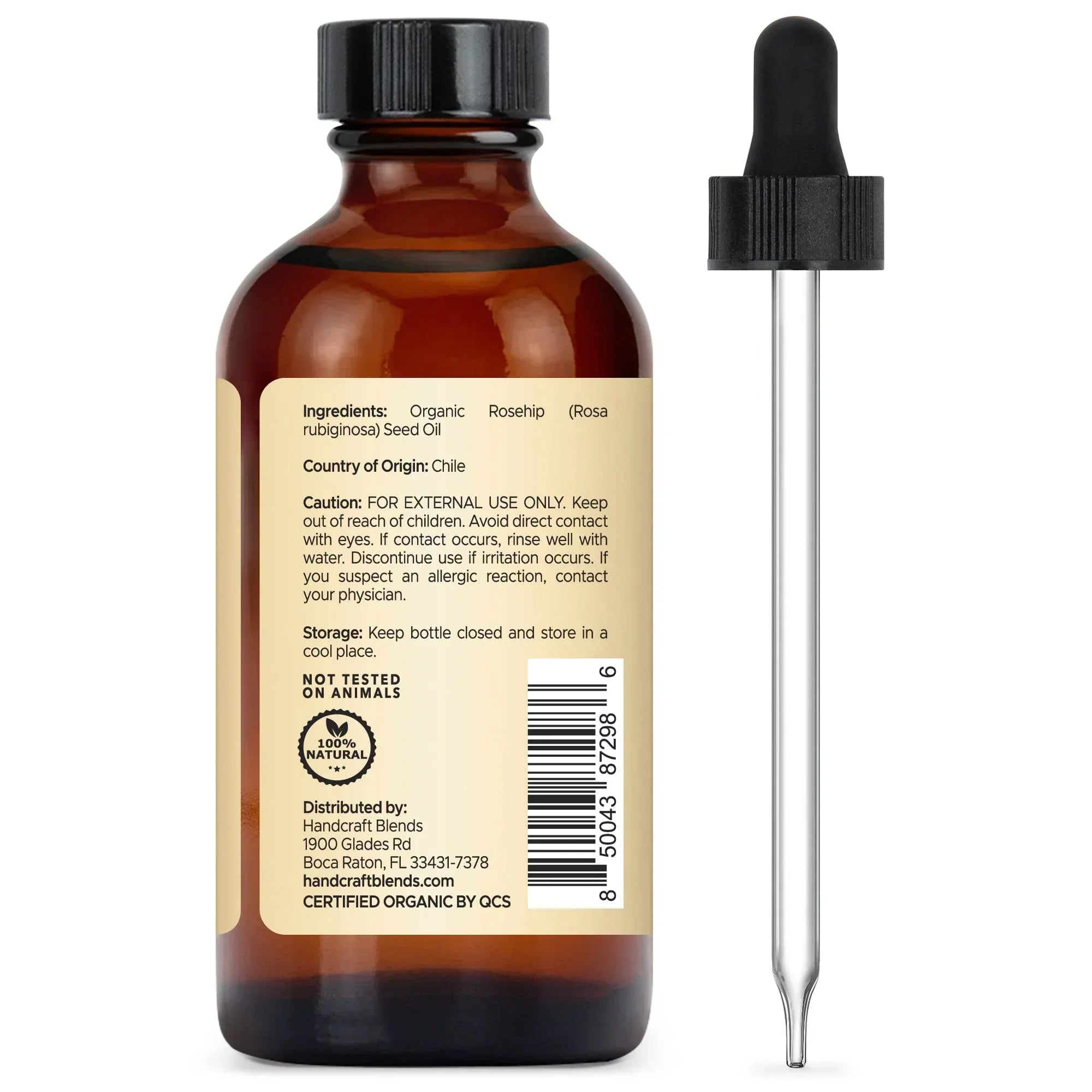 Amber glass bottle of organic rosehip seed oil with dropper and product label visible