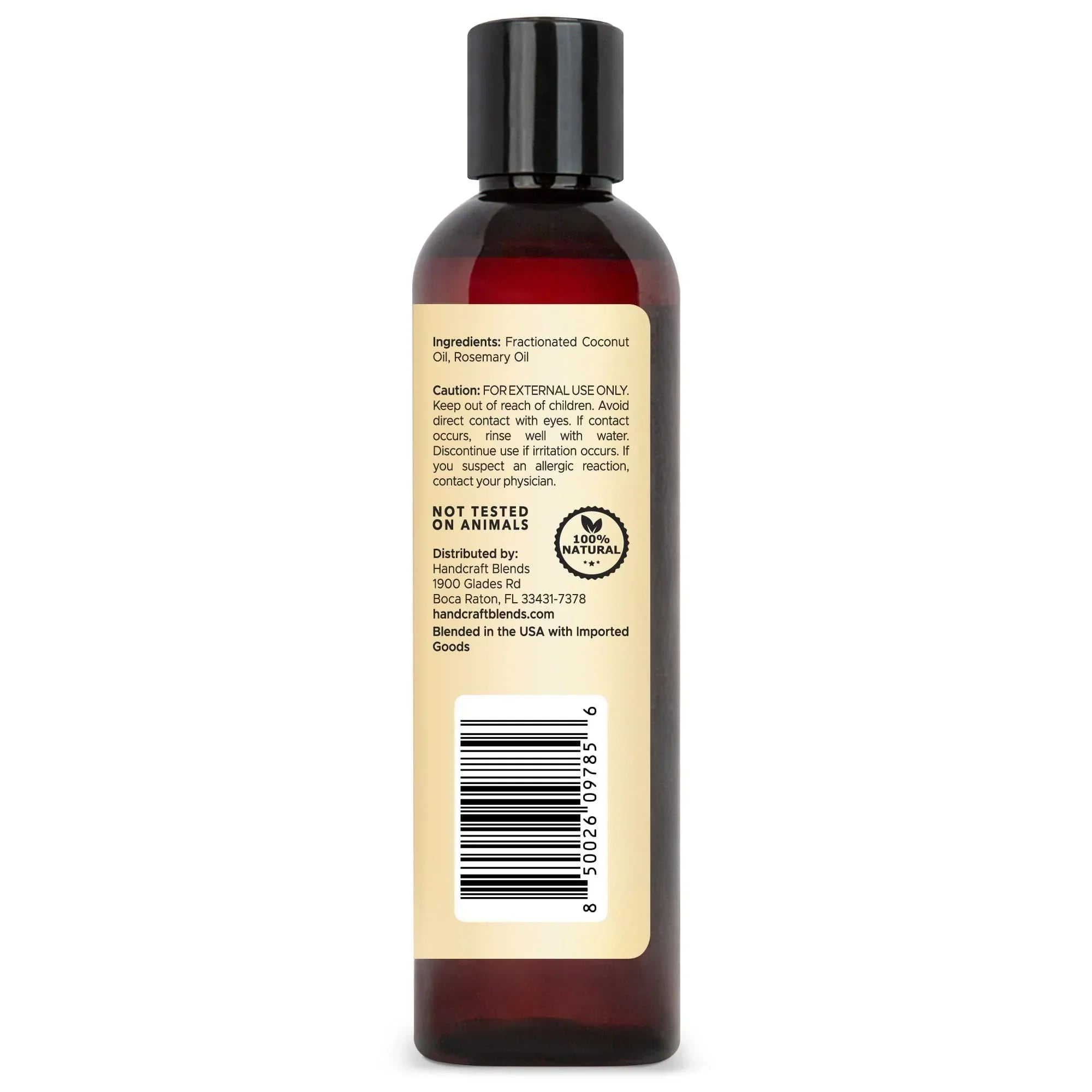 Brown plastic bottle with ingredient and caution label for coconut and rosemary oil blend.