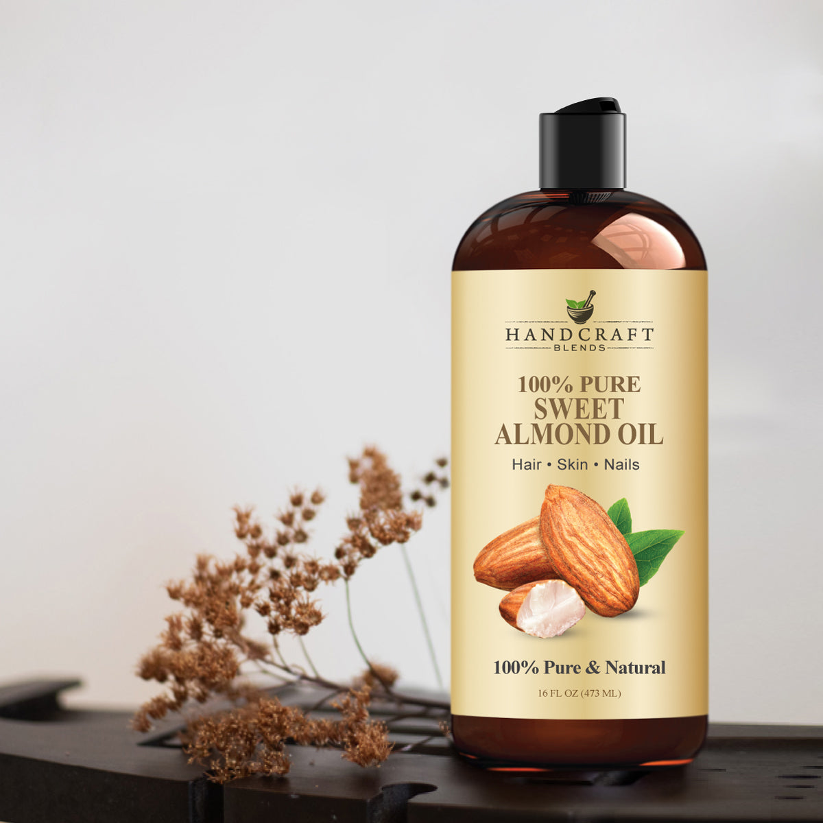 16oz bottle of 100% pure sweet almond oil for hair, skin, and nails with almond illustration
