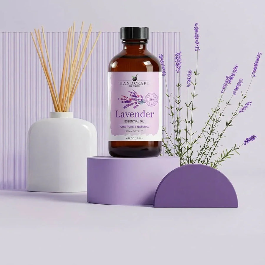 Handcraft Blends lavender essential oil bottle with lavender sprigs and diffuser sticks