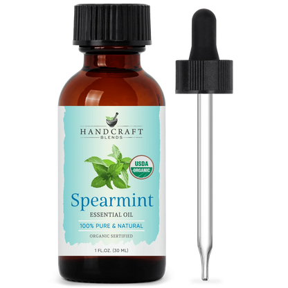 Amber glass bottle of organic spearmint essential oil with dropper, herbal aromatherapy product