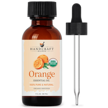 Amber bottle of organic orange essential oil with dropper, labeled pure and natural.