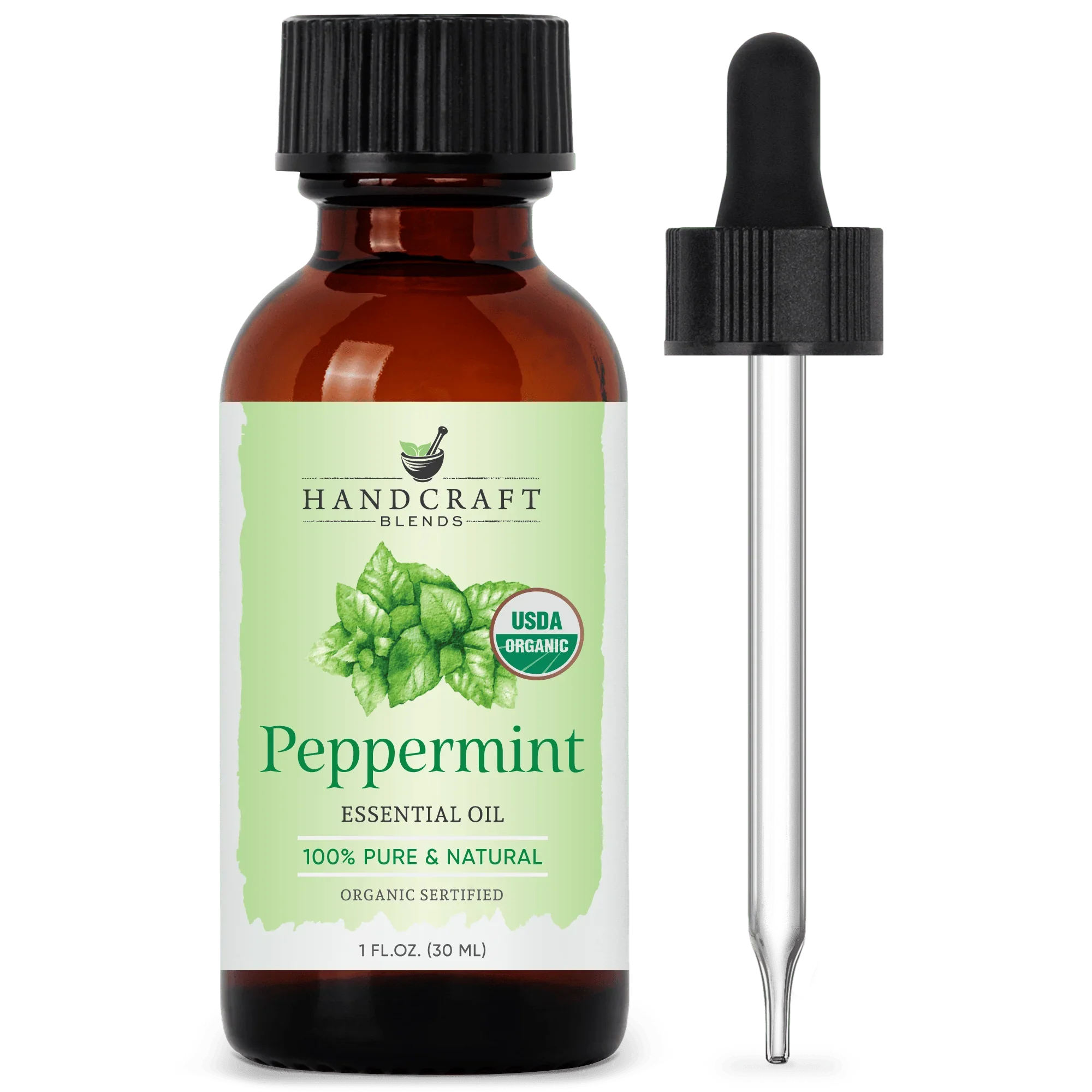 Amber bottle of organic peppermint essential oil with dropper and green mint leaf label
