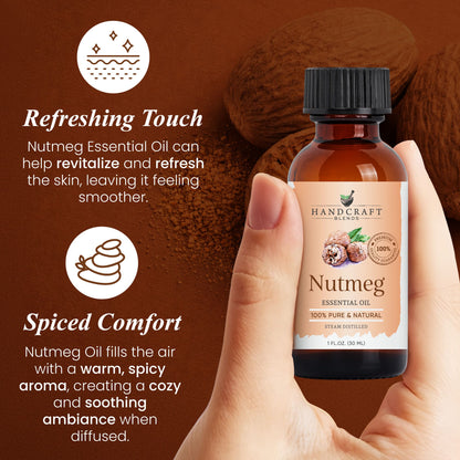 Hand holding a bottle of nutmeg essential oil with nutmeg seeds and powder in the background