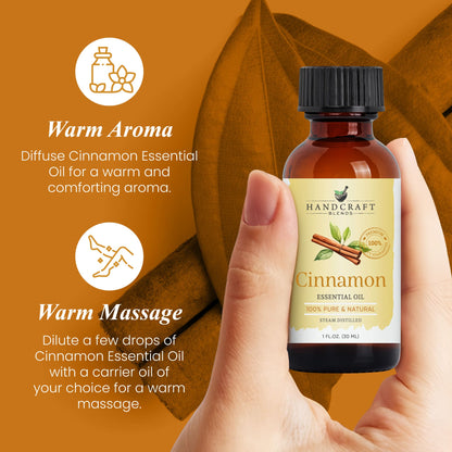 Hand holding cinnamon essential oil bottle for aromatherapy and massage on brown background.