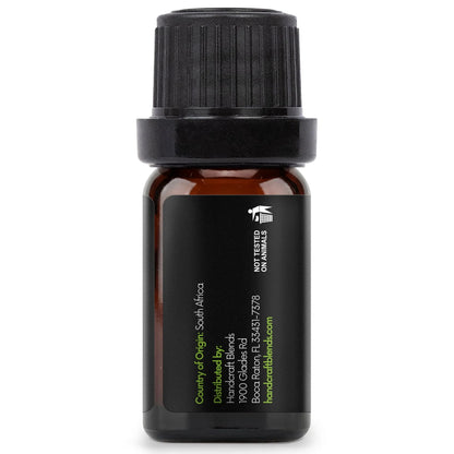 Amber glass essential oil bottle with black label and cap, aromatherapy product.