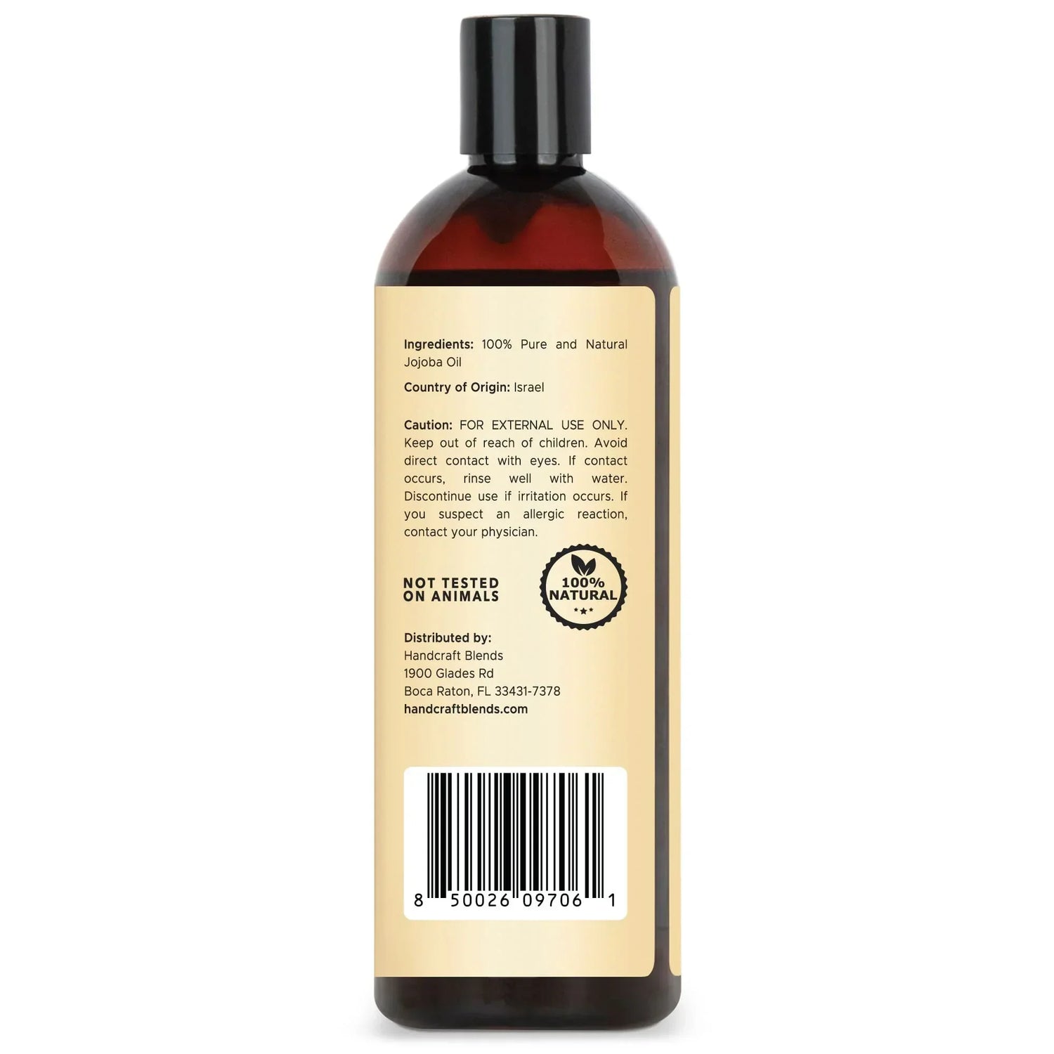 Back of a 16oz amber bottle labeled 100% pure jojoba oil, showing ingredients, origin, and barcode.