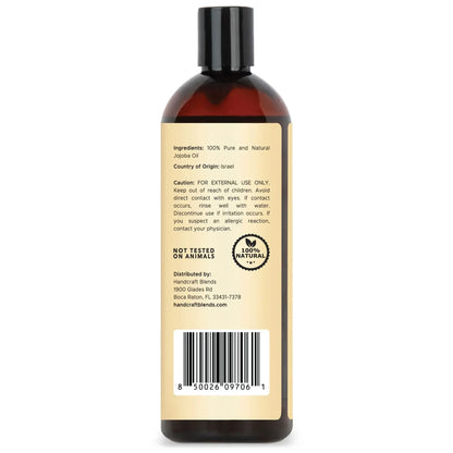 Back of a 16oz amber bottle labeled 100% pure jojoba oil, showing ingredients, origin, and barcode.