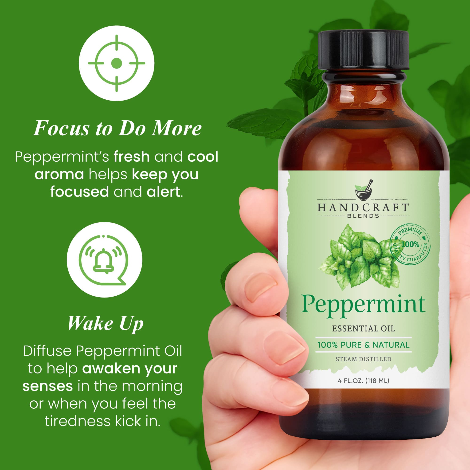 Hand holding a 4 oz bottle of peppermint essential oil with mint leaves on label and green background.