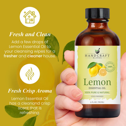 Hand holding 4oz lemon essential oil bottle, yellow background with lemon and leaves, text about fresh scent and cleaning benefits.