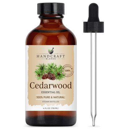 Amber bottle of cedarwood essential oil with dropper, labeled 100% pure and natural.