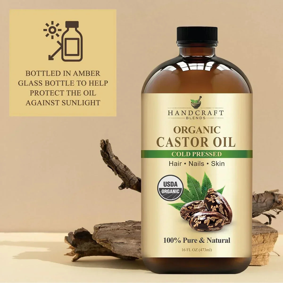 Amber glass bottle of organic cold pressed castor oil for hair, nails, and skin with natural decor.