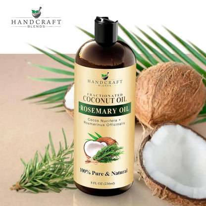 Fractionated coconut oil with rosemary oil bottle, coconuts, and rosemary sprigs