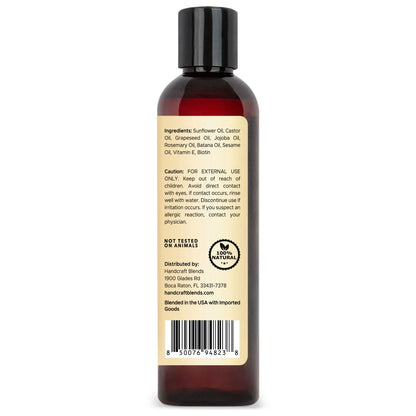 Brown bottle of carrier oil with ingredient list, caution, and 100% natural label on back
