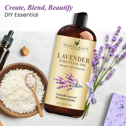 Lavender essential oil bottle with lavender flowers, bath beads, dropper, and soap on white background